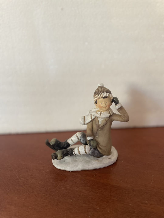 Christmas Figure Boy Sitting Ice Skates