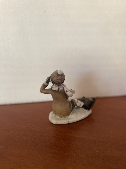 Christmas Figure Boy Sitting Ice Skates