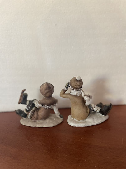 Set of Christmas Figures 1 Girl 1 Boy Sitting Skates