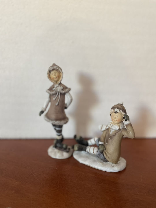 Set of Christmas Figures 1 Standing Girl 1 Sitting Boy Ice Skates