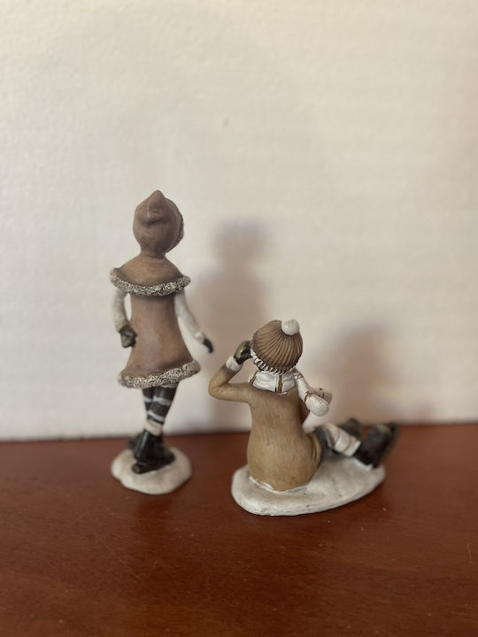 Set of Christmas Figures 1 Standing Girl 1 Sitting Boy Ice Skates