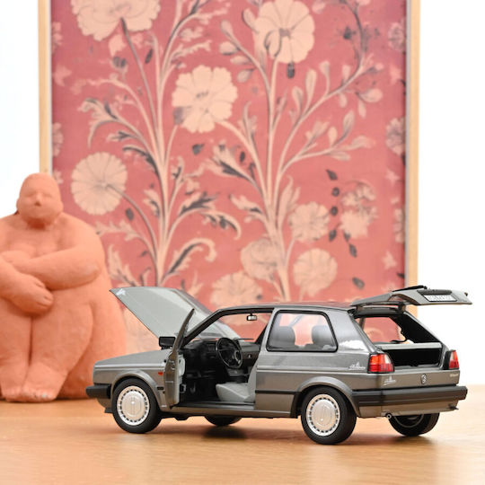 Machete Auto Volkswagen Golf Champion Grey Metallic 1989 1:18 Norev
