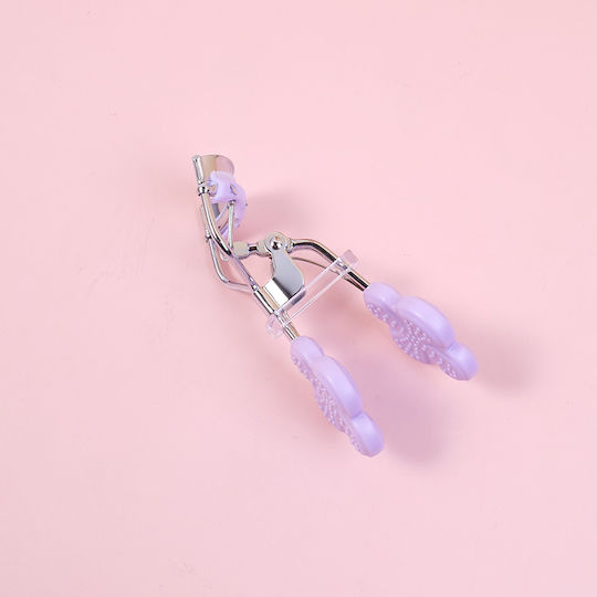 Wimpernschere Blumenmuster