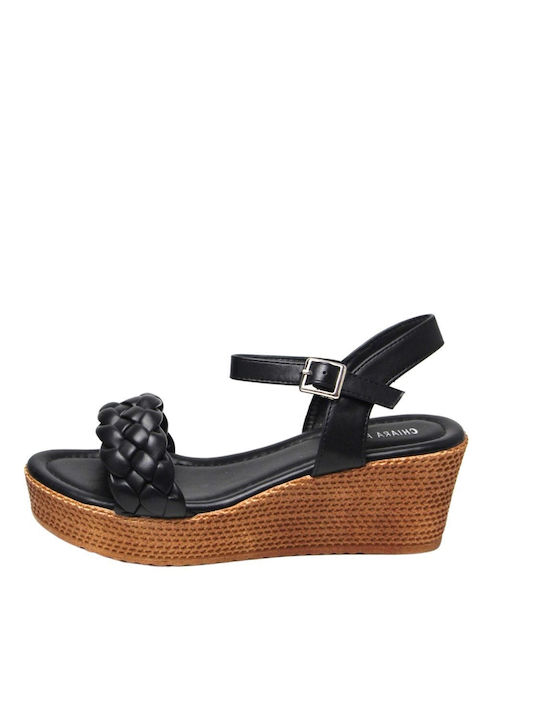 Black leather platforms with woven strap and ankle strap