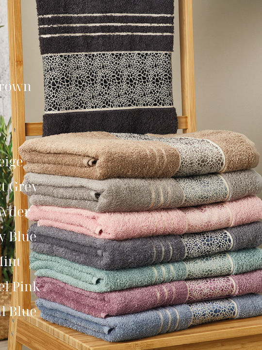 Tan and white bath towels top